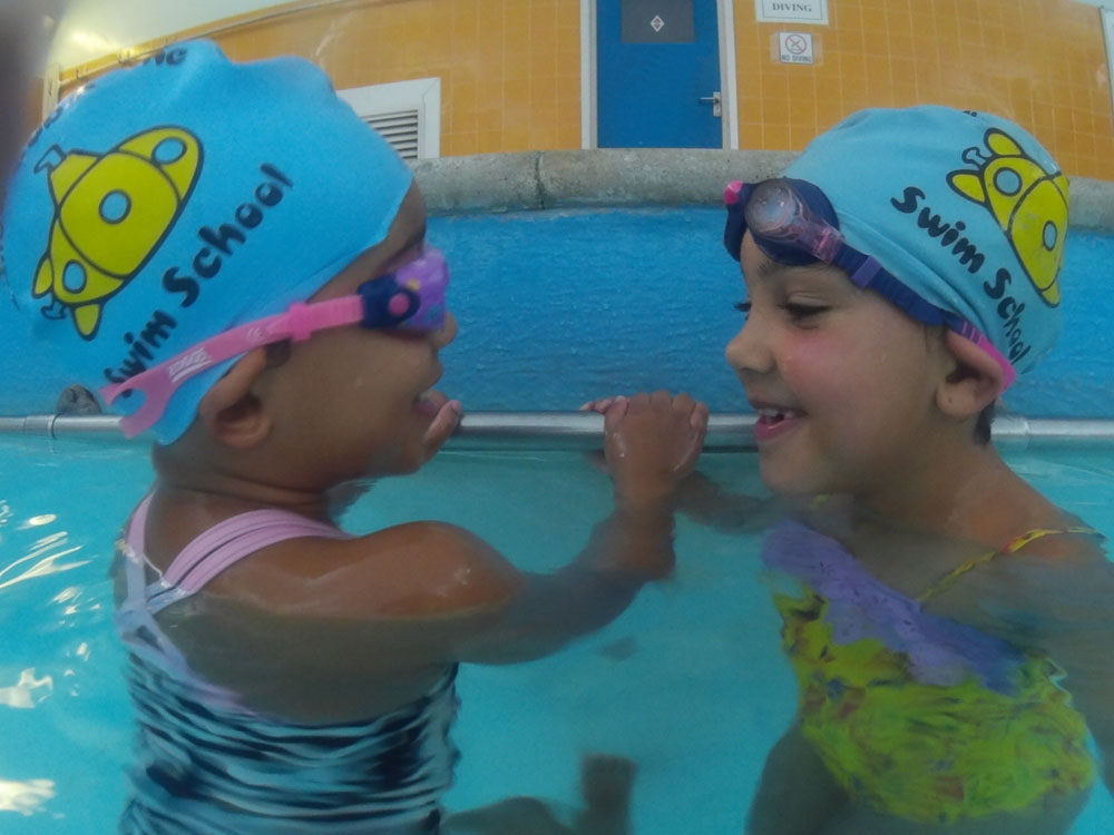 girls having a swimming lesson